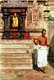 India: A Hindu priest at a statue of Kali (the fierce aspect of the Hindu goddess Durga or Parvati), Thillai Nataraja Temple, Chidambaram, Tamil Nadu